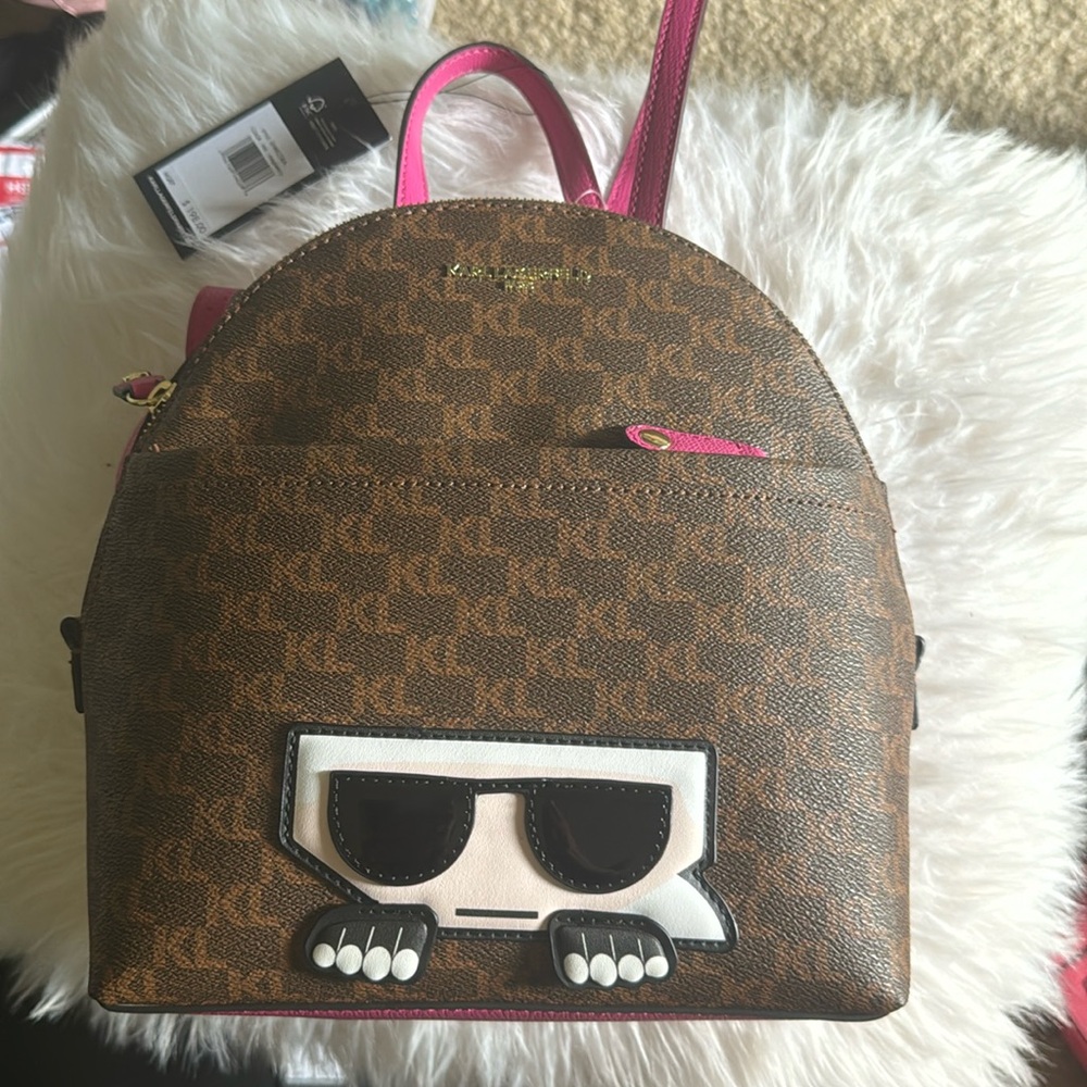 Karl Lagerfeld Paris monogram backpack with pink straps and zipper pulls! NWT